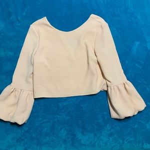 Pale pink blouse with puff sleeves